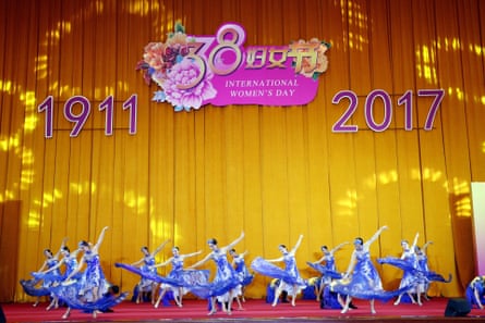 Performers dance during a gathering attended by Chinese women from various circles and foreign diplomats ahead of International Women’s Day in Beijing