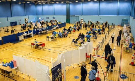 Booster vaccines being given in a sports hall on 5 October in Cwmbran, Wales