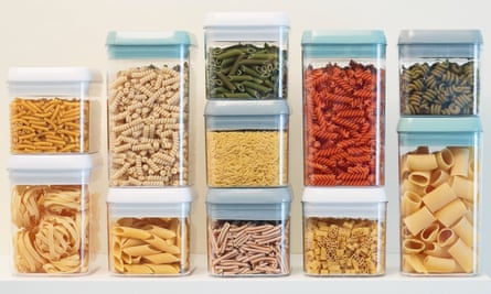 Stacks of clear boxes, each containing a different type of pasta