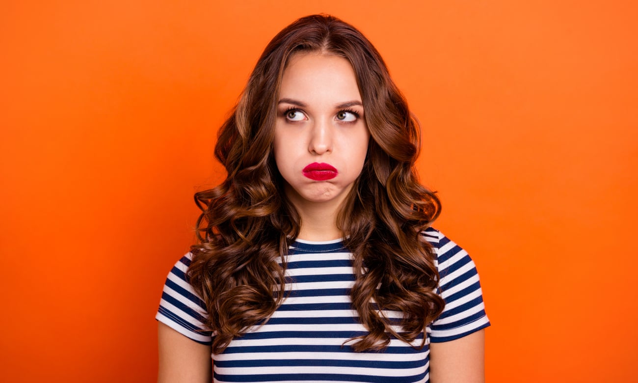 Close up photo beautiful she her lady red lipstick hold breath full mouth air ignore not listen speak talk tell look up wear casual striped white blue t-shirt clothes isolated orange bright background.