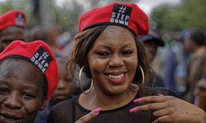 Protesters wear #stepdown berets.