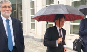 Eduardo Li, a defendant in the Fifa corruption case, walks with his lawyer outside of US federal court in New York on Monday.