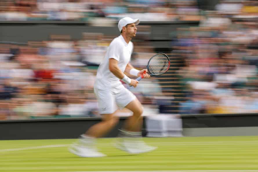Andy Murray positions himself to receive a shot from James Duckworth.