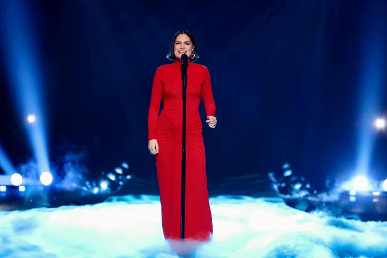 Jessie J performing in a dress covering her tattoos.