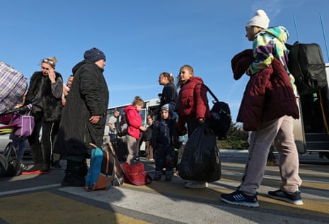 Civilians arriving at the railway station in Dzhankoi, Crimea, after Russian-installed officials forcibly moved them from occupied Kherson.