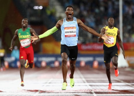 Isaac Makwala celebrates winning gold as he crosses the line.