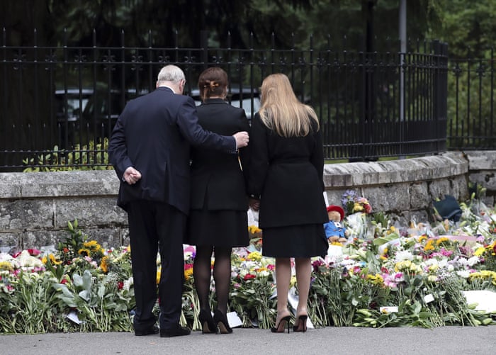 Princess Eugenie and Princess Beatrice are consoled by their father Prince Andrew.