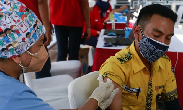 Mass vaccination programme at a train station in Jakarta