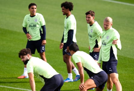 Erling Haaland (right) and his Manchester City teammates in training.