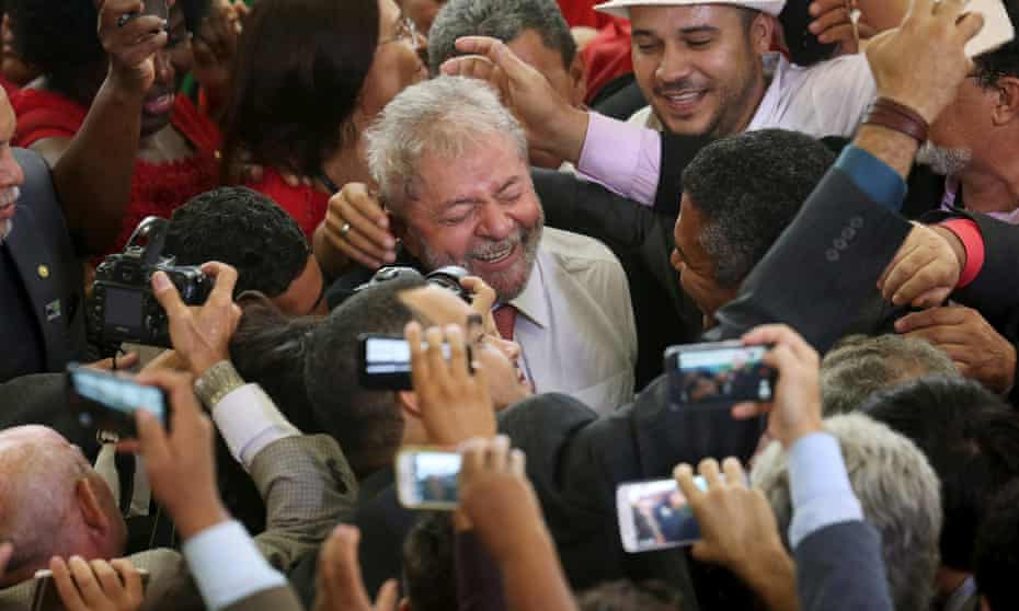 Luiz Inácio Lula da Silva is greeted by supporters after his appointment as chief of staff to president Dilma Rousseff.