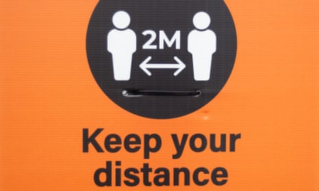 A sign reminding people to socially distance.