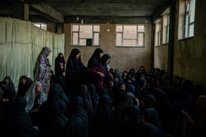 In the basement of an unfinished mosque neighbours and relatives of two of the victimsof an  explosion outside a high school in Kabul, Afghanistan in May 2021  have gathered to support their mothers through their grief