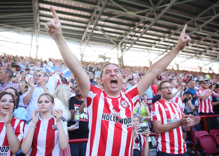 Brentford fans cheer on their team.