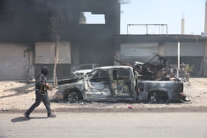 A Bedouin fighter walks on the streets of Sweid