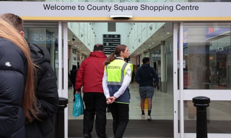 A security worker wearing a stab vest at County Square shopping centre in Ashford, Kent.