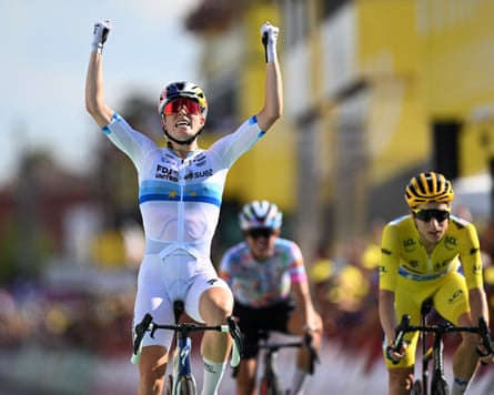 Demi Vollering celebrates after victory in stage five of the Tour de France Femmes.