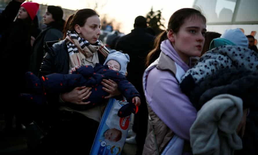 Mothers and children fleeing Ukraine arrive at a temporary camp in Przemyśl, Poland.