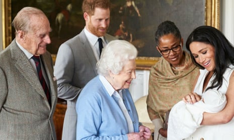 The Queen and Duke of Edinburgh meet royal baby Archie, held by Meghan as Prince Harry and Meghan’s mother, Doria Ragland, look on.