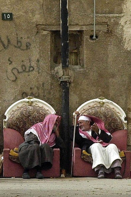 Saudi men chat outside their homes in the poor Riyadh district of al-Shamissi.