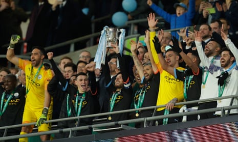 Manchester City players celebrate victory at Wembley as they made it four major domestic trophies in a row. 
