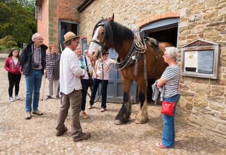 Visitors at Acton Scott. The farm still has its shire horses but has had to sell other animals.