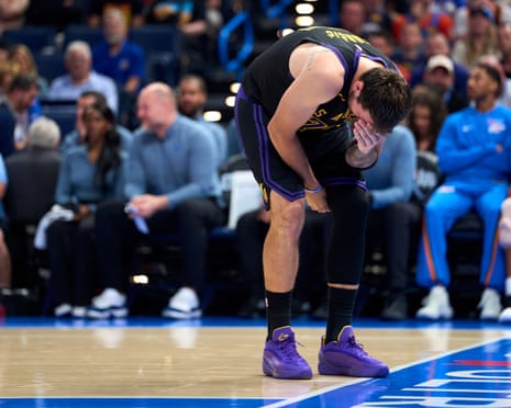 Luka DonÄiÄ winces after injuring his hamstring during the Lakers' loss to the Thunder.