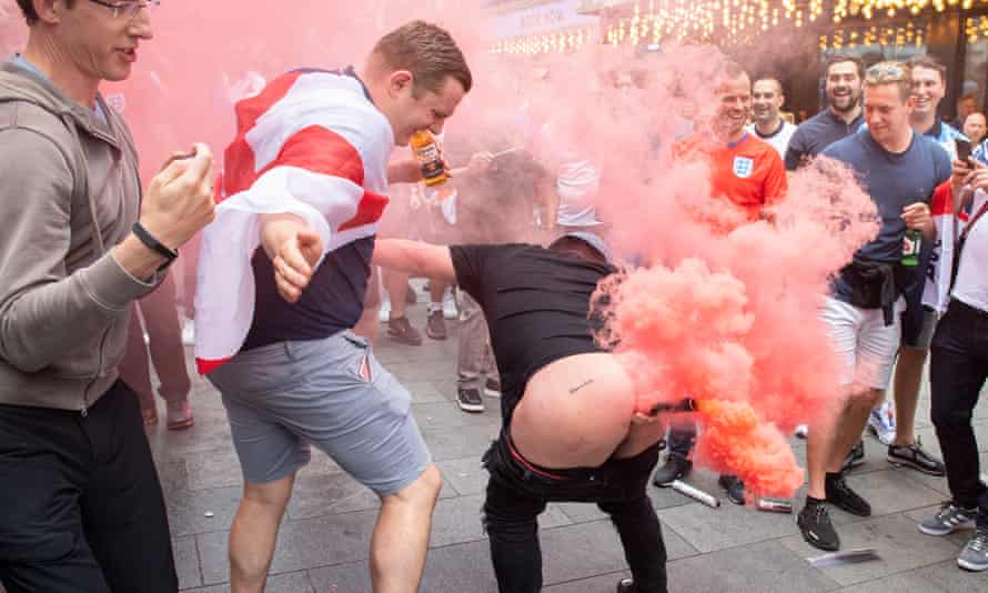 England fan with lit flare in his buttocks