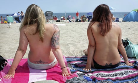 Women go topless as they participate in the Free the Nipple global movement during Go Topless Day at Hampton Beach, New Hampshire in 2017. 