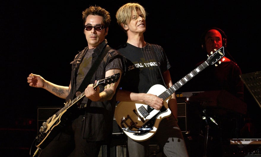 Slick with Bowie in 2003.
