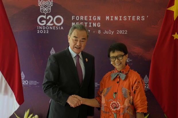 Chinese foreign minister Wang Yi with his Indonesian counterpart Retno Marsudi after arriving in Bali.