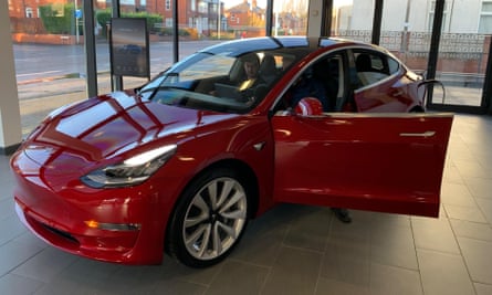 The Tesla Model 3 car on display in a showroom in Manchester