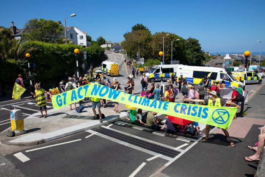 Extinction Rebellion protesters blocking a pelican crossing in St Ives