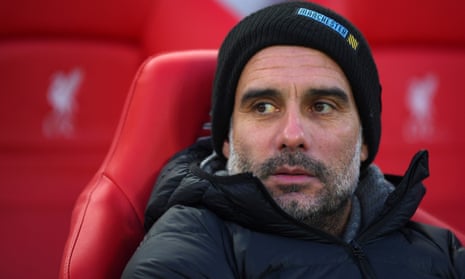 Pep Guardiola watches his team slip to defeat at Anfield.