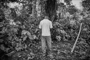 Dennis Anyaka stands in front of a tree