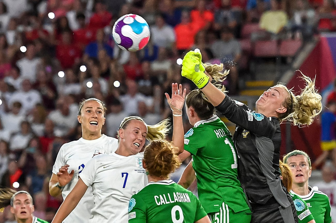Northern Ireland goalkeeper Jacqueline Burns beats Beth Mead of England to the ball and punches clear.