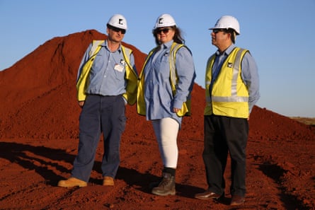 Gina Rinehart stands for a photograph with two of her executives during a tour of the Roy Hill Mine operations in Western Australia in 2014.
