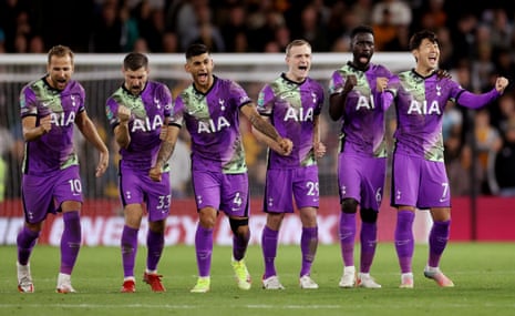 Spurs players celebrate after winning the penalty shoot out.