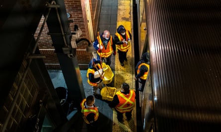 MTA workers prepare to clean a subway car on 6 May.