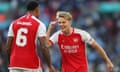 Martin Ødegaard points to his head in a celebratory gesture towards Gabriel during their Community Shield match against Manchester City at Wembley