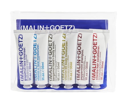 Malin + Goetz travel set with six branded tubes of products including, face wash, moisturiser, body wash, shampoo and conditioner.