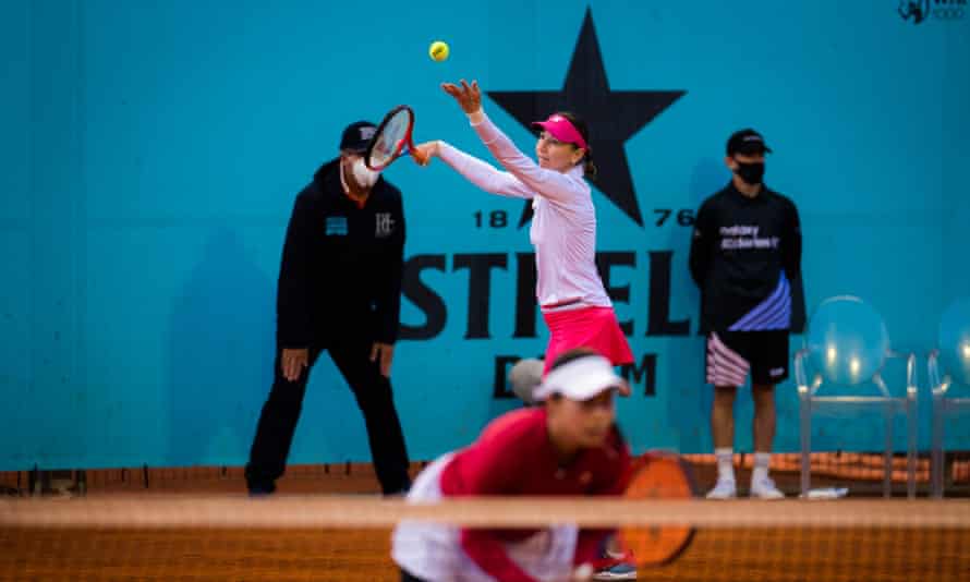 Renata Voráčová of the Czech Republic and Nao Hibino of Japan play doubles at the 2021 Mutua Madrid Open WTA 1000 tournament in May 2021.