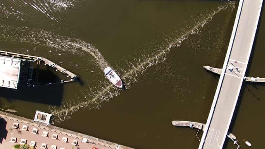 The bubble barrier was developed as a simple way to stop plastic pollution flowing from waterways into the ocean. An air compressor sends air through a perforated tube that runs diagonally across the bottom of the channel, creating a flow of bubbles that trap waste and guide it to a collection system. According to the Dutch social enterprise behind the system, it traps 86% of the waste that would otherwise flow into the IJ River and further into the North Sea.