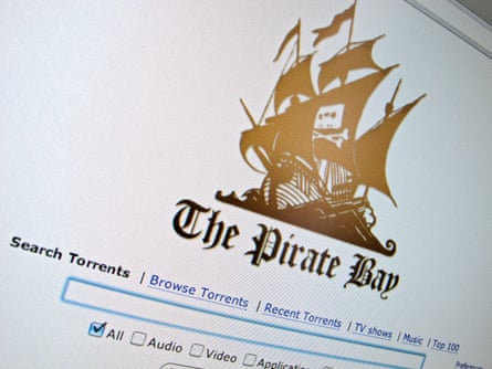 The homepage of a website called The Pirate Bay shows an image of a ship with a cassette tape and crossbones, as well as a search bar