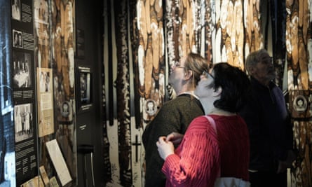 Visitors look at exhibits at the new museum
