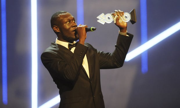 Stormzy accepts his award for best grime act during the Mobo awards in November 2015
