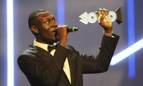 Stormzy accepts the Mobo award for best grime act in 2015.