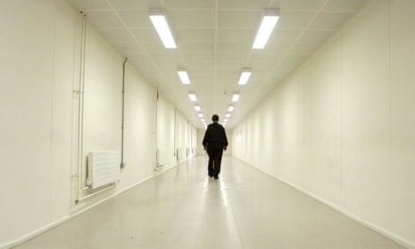 A security officer walks down one of the corridors of Yarl’s Wood immigration removal centre, Bedford.
