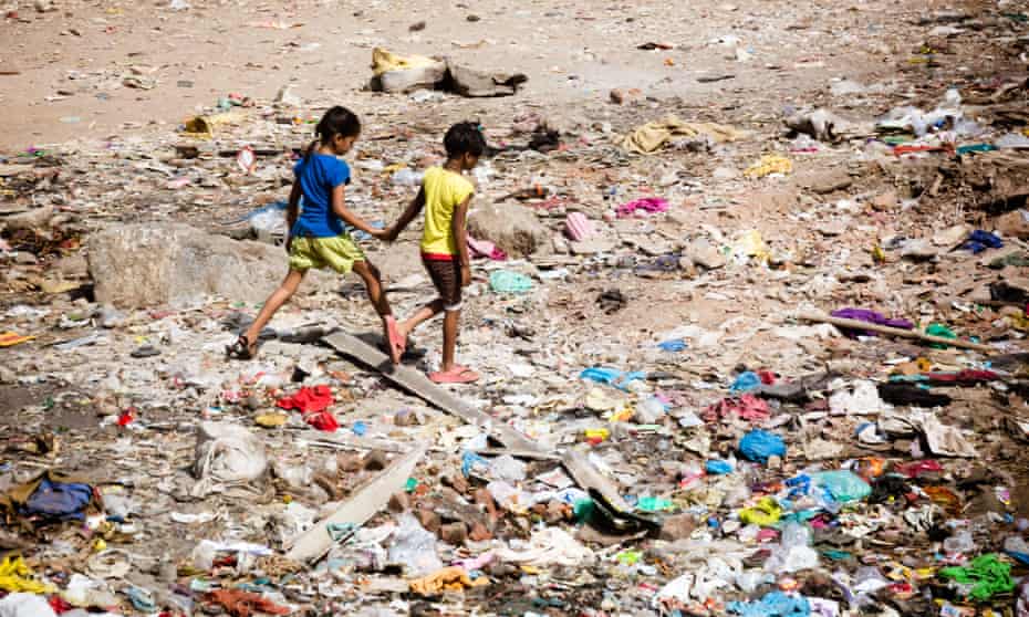 Children play on a wasteland in a Mumbai slum