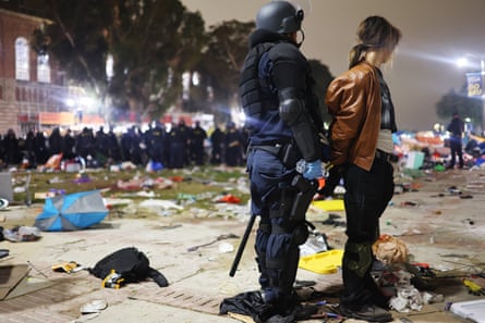 A protester on campus is arrested by police