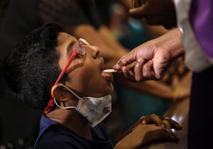 A child receives sacramental bread at St. Anthony’s Church in Colombo, Sri Lanka